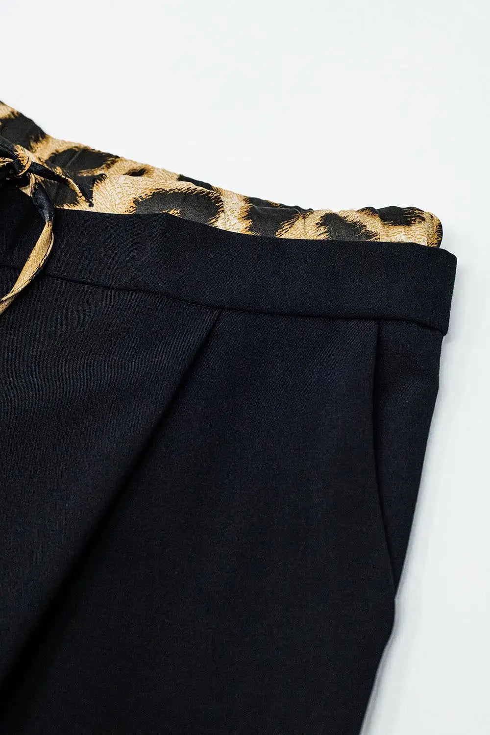 Long black pleated pants with leopard detail at the waist - Pants