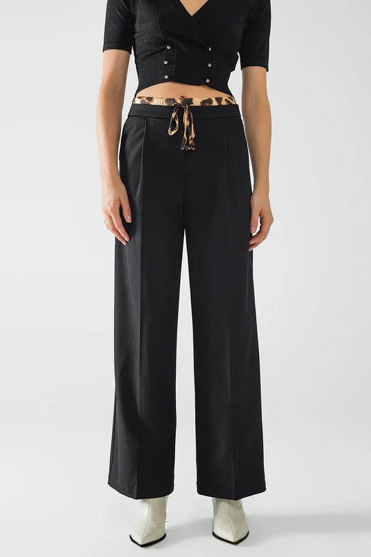 Long black pleated pants with leopard detail at the waist - Pants