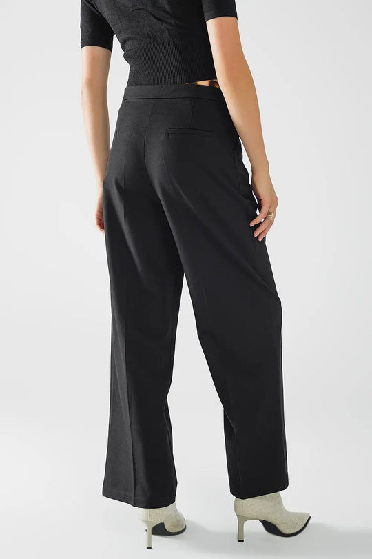Long black pleated pants with leopard detail at the waist - Pants