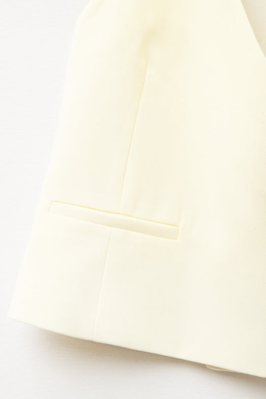 Yellow wrap vest with detailed gold button