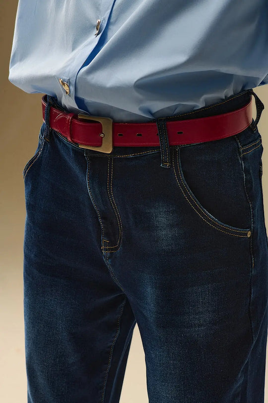 Dark wash jeans with contrast stitching and cuffed hems