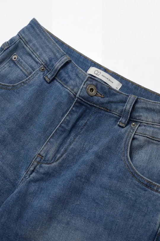 Mid-Wash Curved-Leg Jeans with Folded Hem Seam