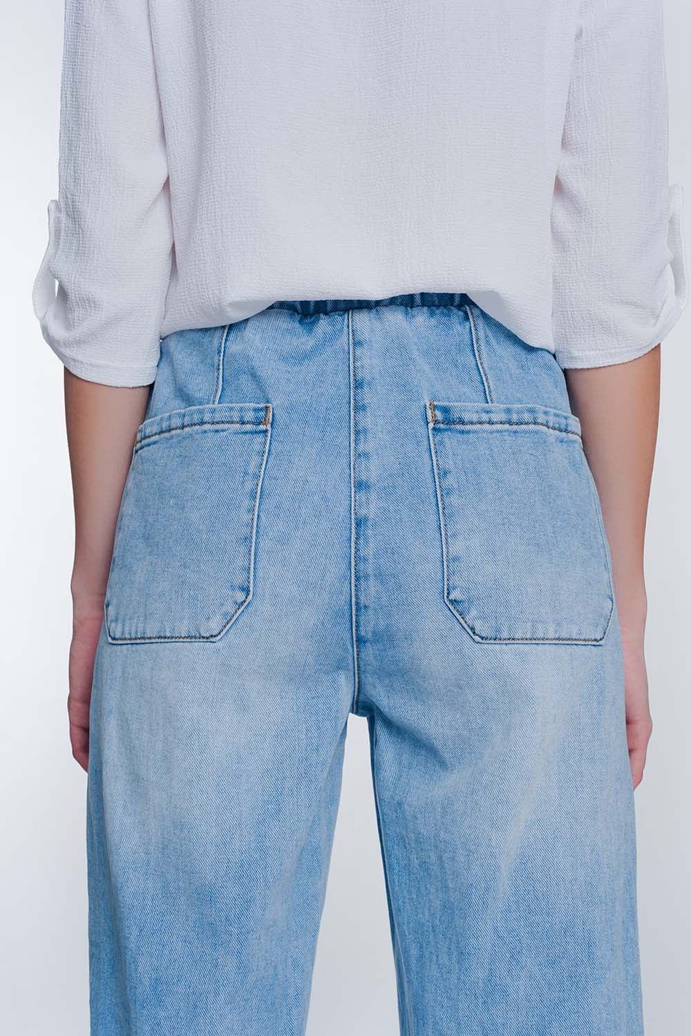 Heavily ripped boyfriend jeans in light denim