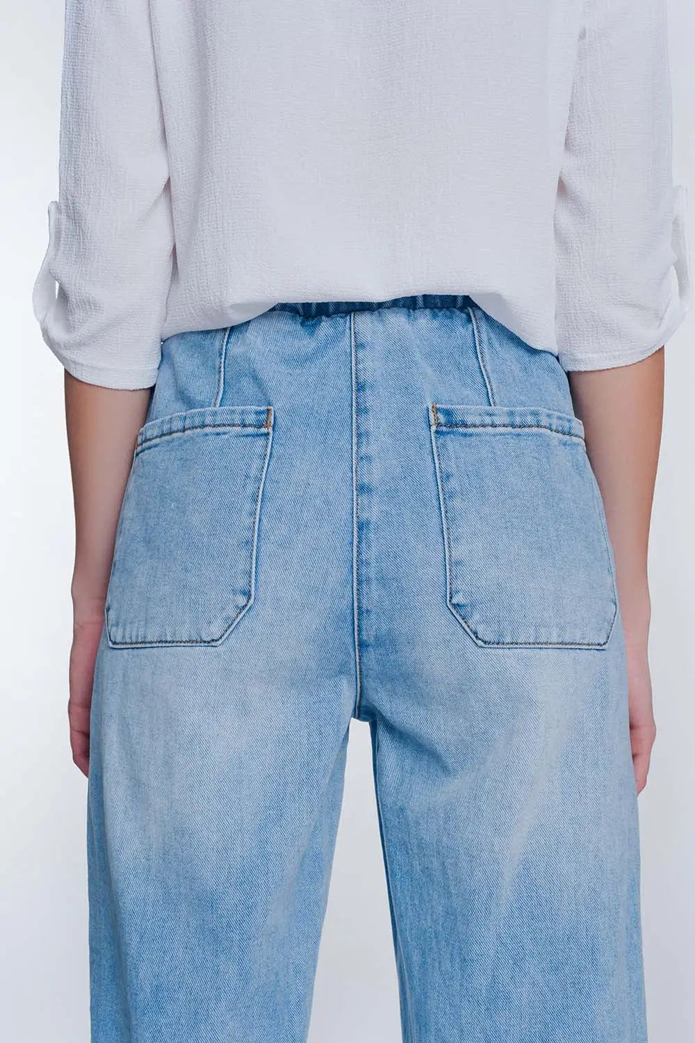 Heavily ripped boyfriend jeans in light denim