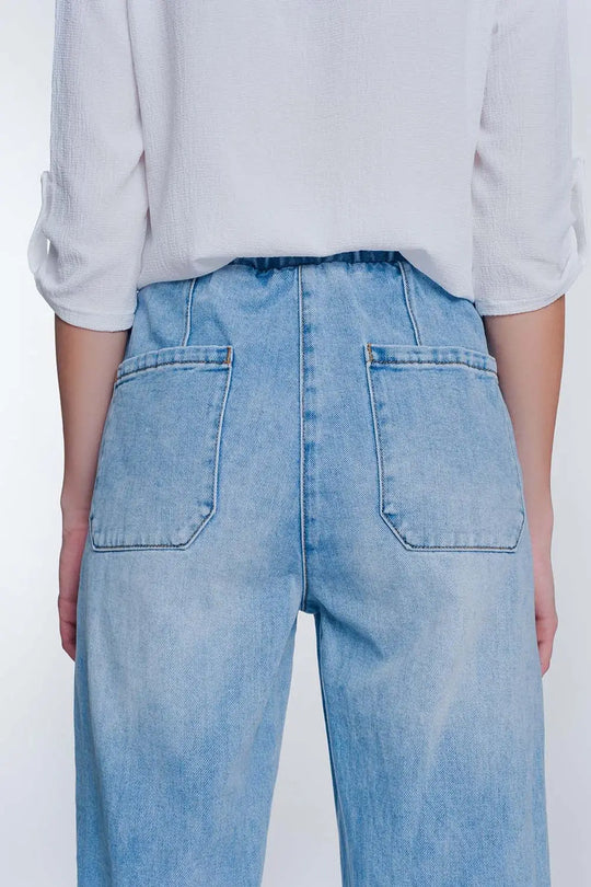 Heavily ripped boyfriend jeans in light denim