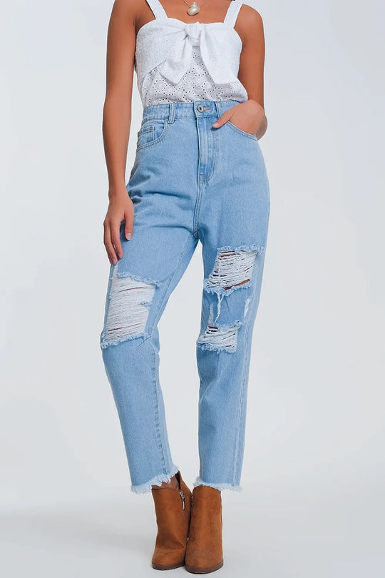 High waist mom jeans with busted knees in light denim