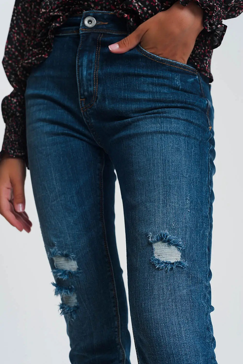 High waisted skinny jeans in dark wash blue with ripped details