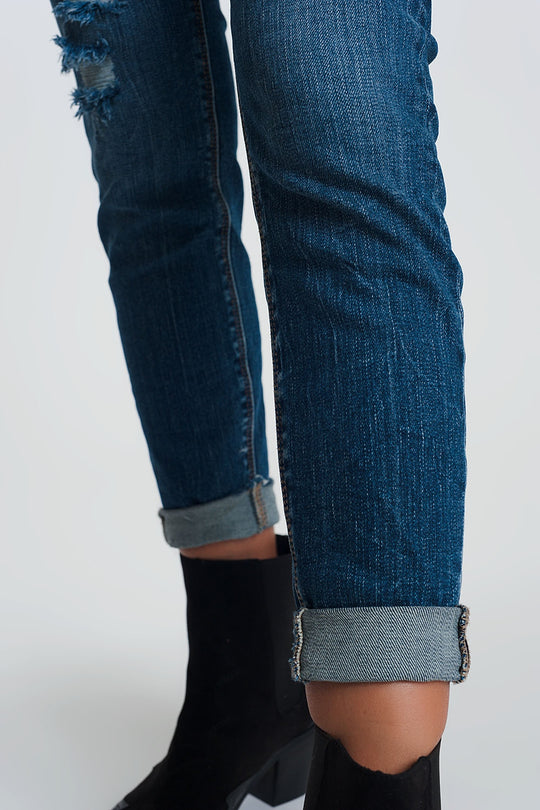 High waisted skinny jeans in dark wash blue with ripped details