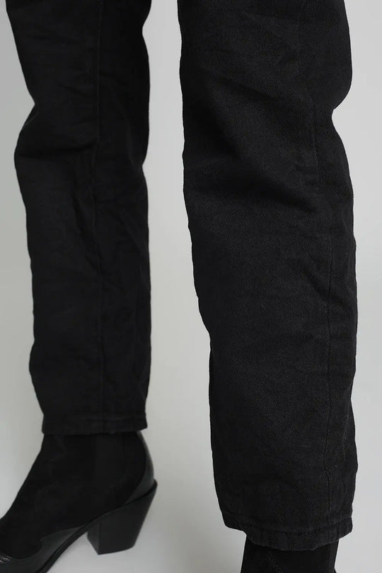 Jeans with paper bag waist and button details in black - Colored Jeans