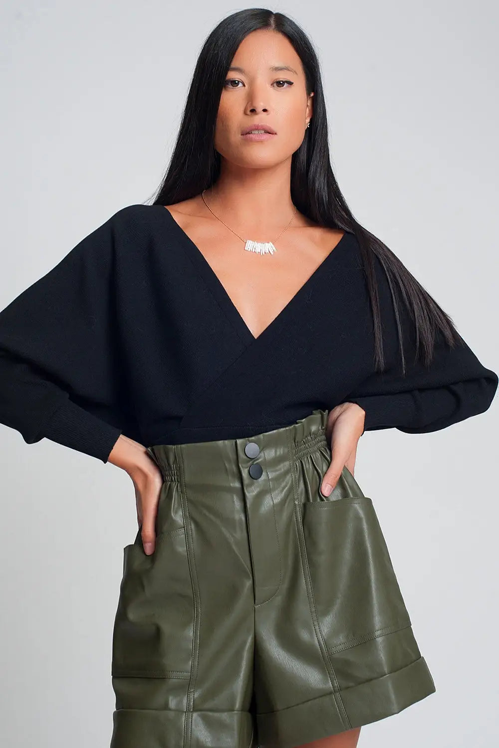 Knitted sweater with wrapped V-neck in black - Sweaters