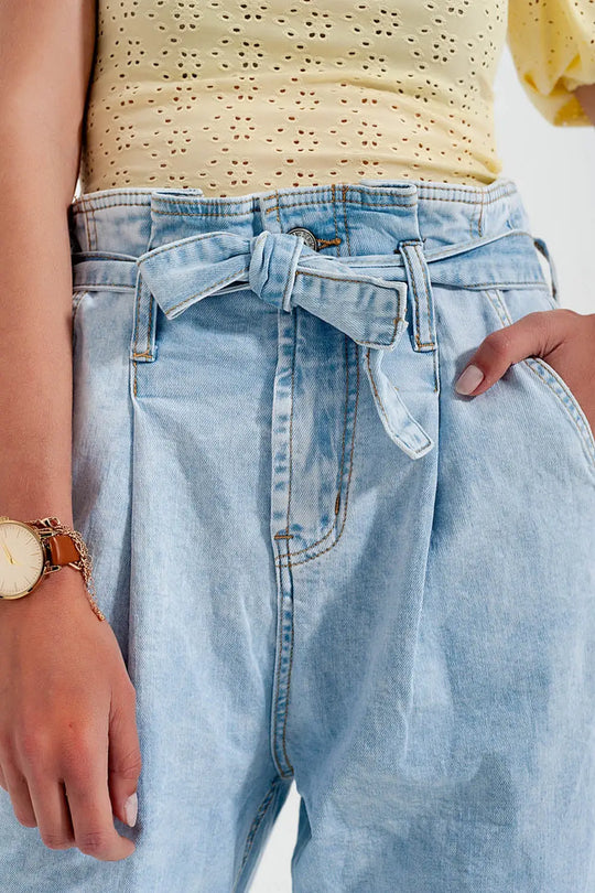 Tapered leg jeans with paper bag waist in light vintage wash