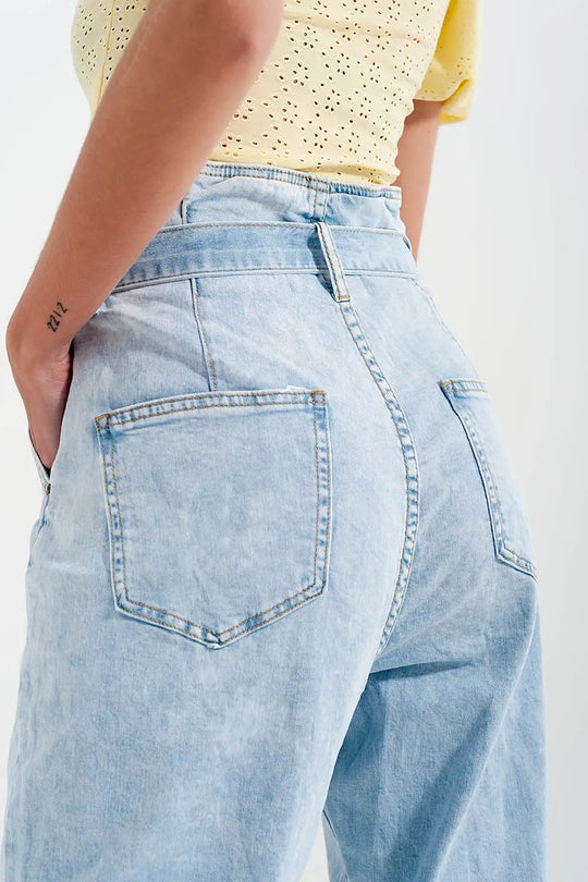 Tapered leg jeans with paper bag waist in light vintage wash