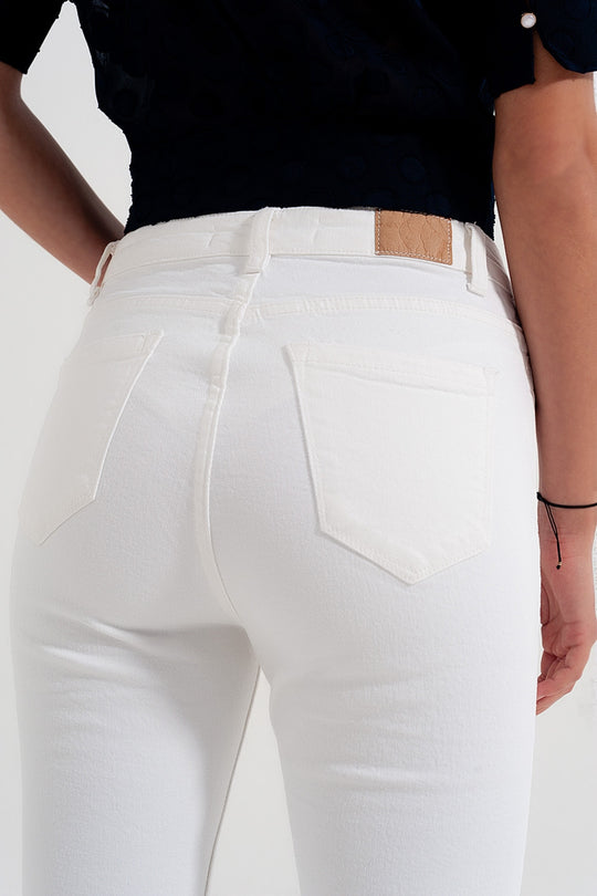 Rigid cropped flare jeans in cream with raw hem
