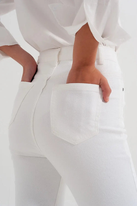 Slim jeans with asymmetric button in cream - Colored Jeans