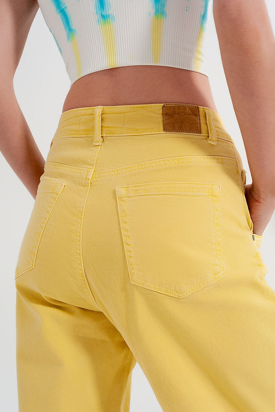 High rise mom jeans with pleat front in yellow