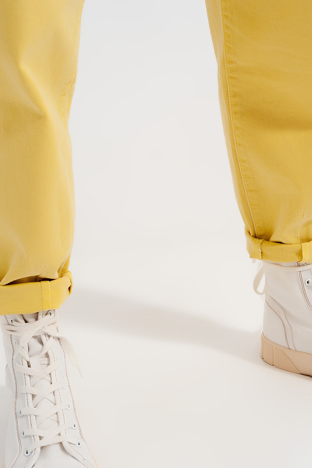 High rise mom jeans with pleat front in yellow