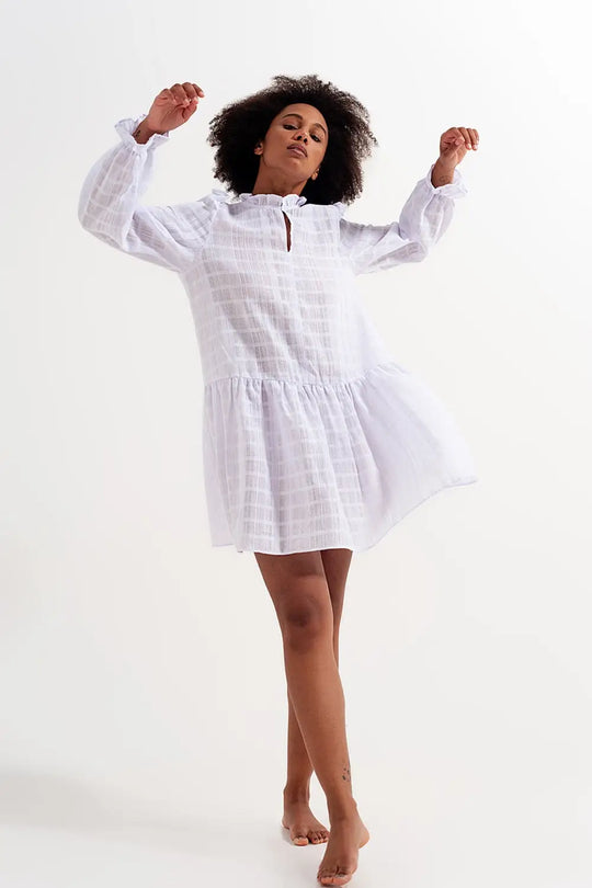 Voluminous mini dress with ruffles in white - Dresses