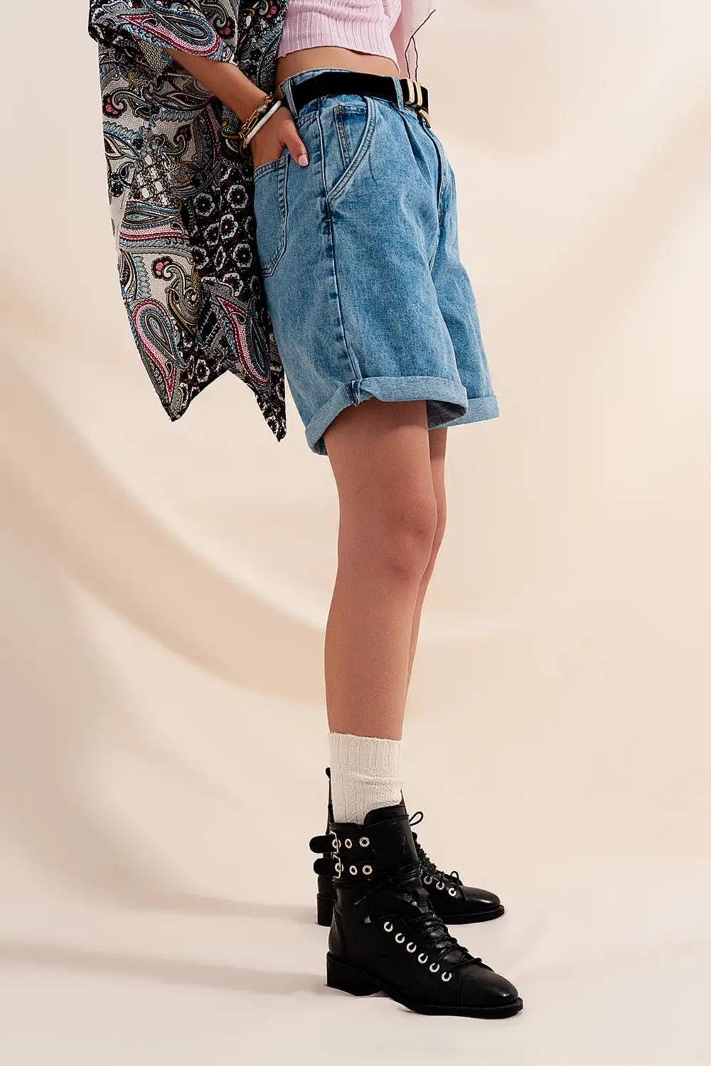 High waisted pleated denim shorts in mid wash