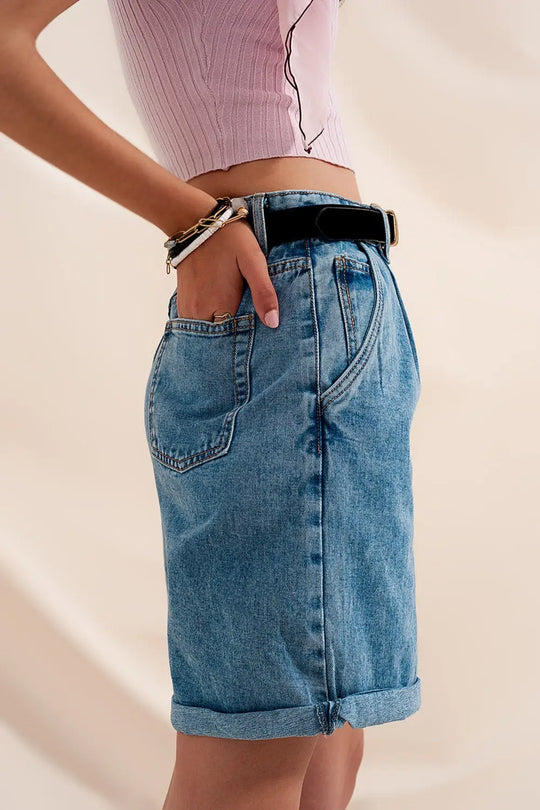 High waisted pleated denim shorts in mid wash