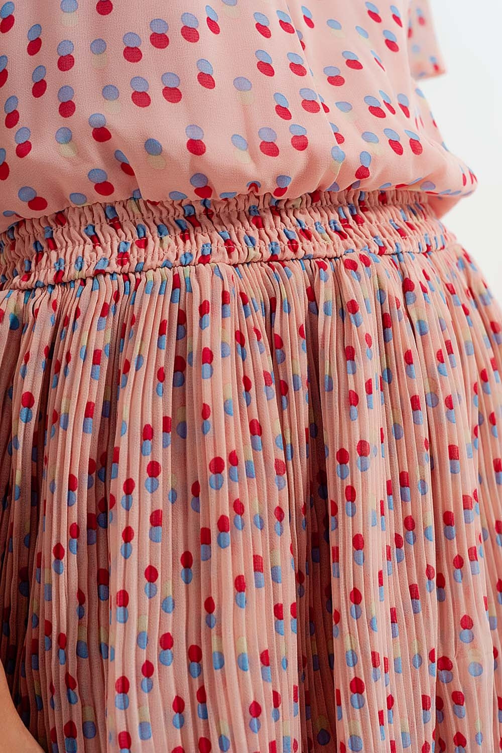 Shirred mini dress with peplum in pink