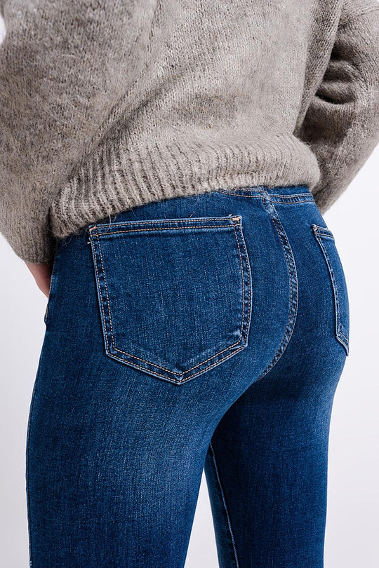 High waisted jeans with asymmetrical hem