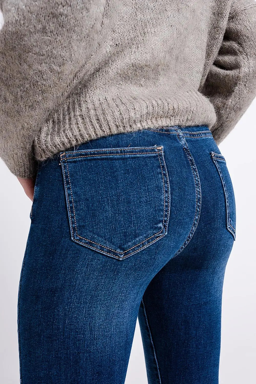 High waisted jeans with asymmetrical hem