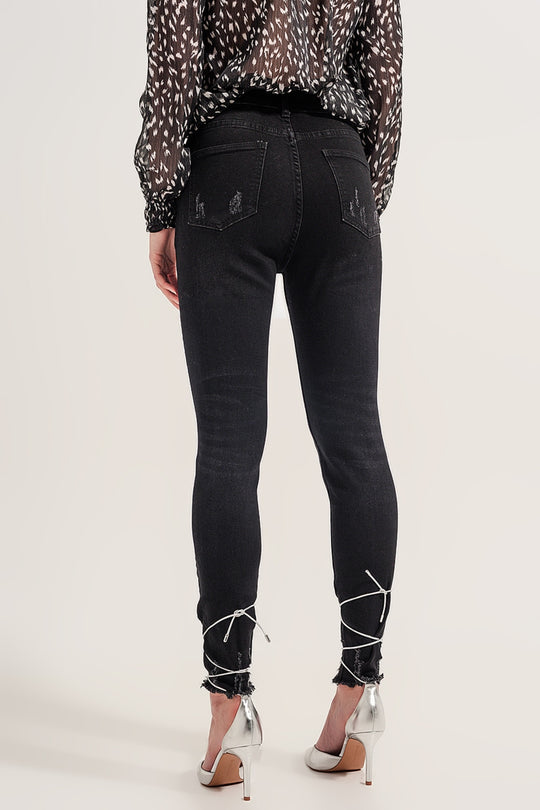 Raw hem skinny jeans in washed black