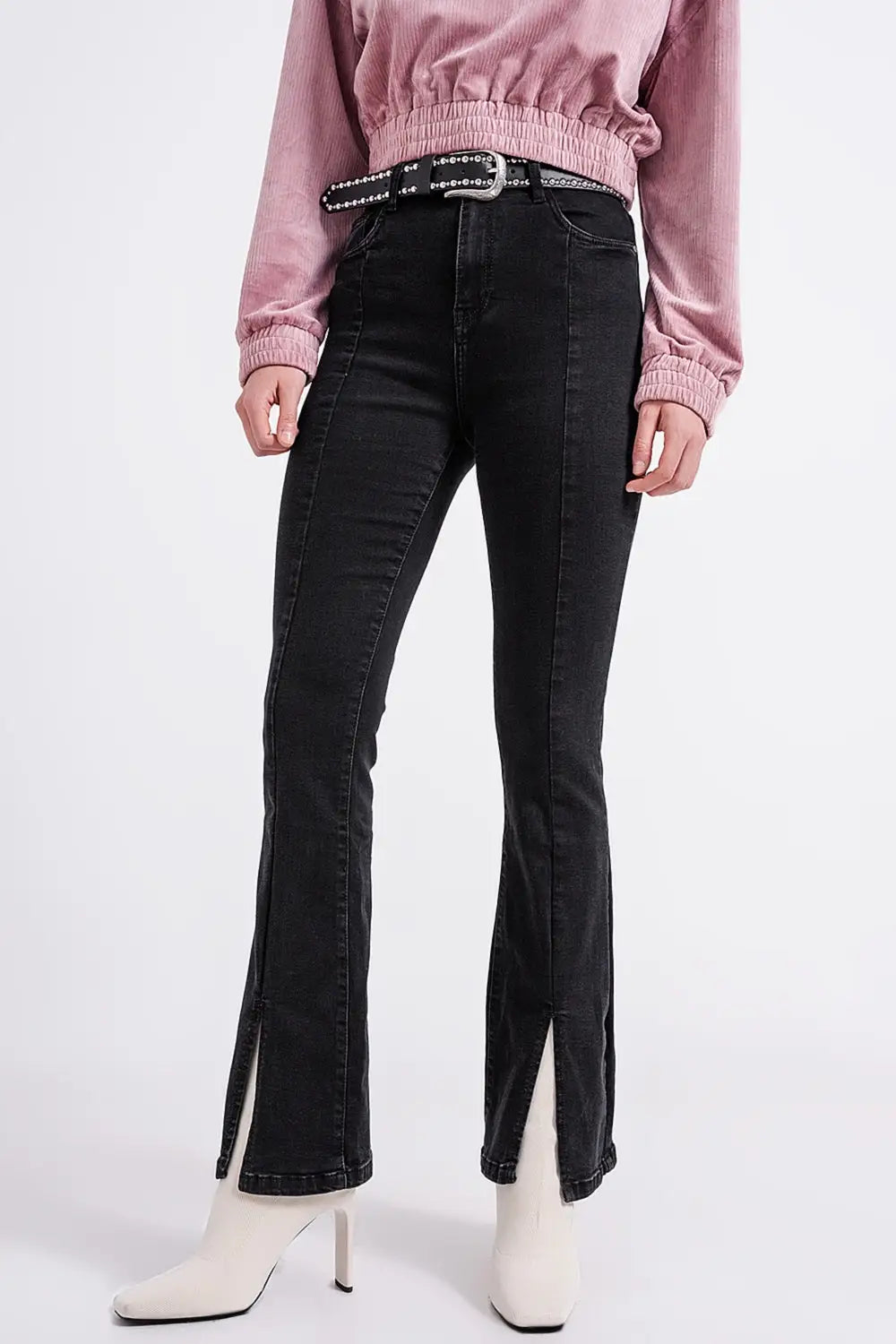 Flare black jeans with split hem