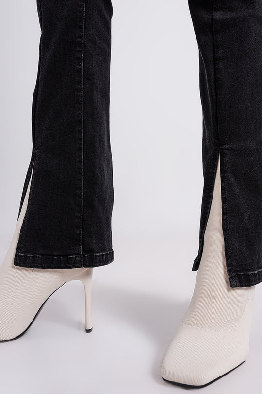 Flare black jeans with split hem