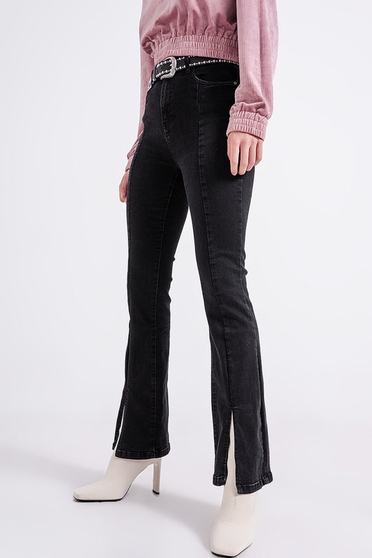 Flare black jeans with split hem