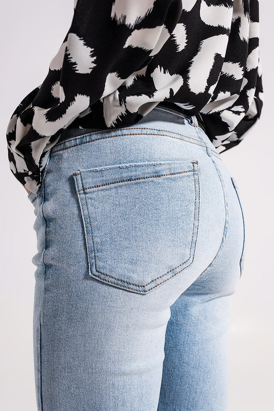 High waist jeans with slit hem in vintage wash