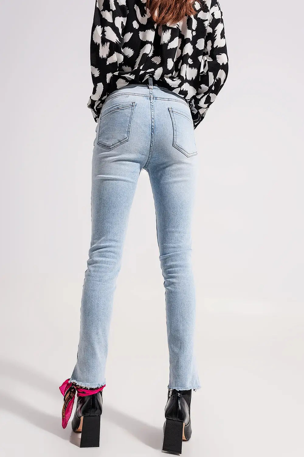 High waist jeans with slit hem in vintage wash