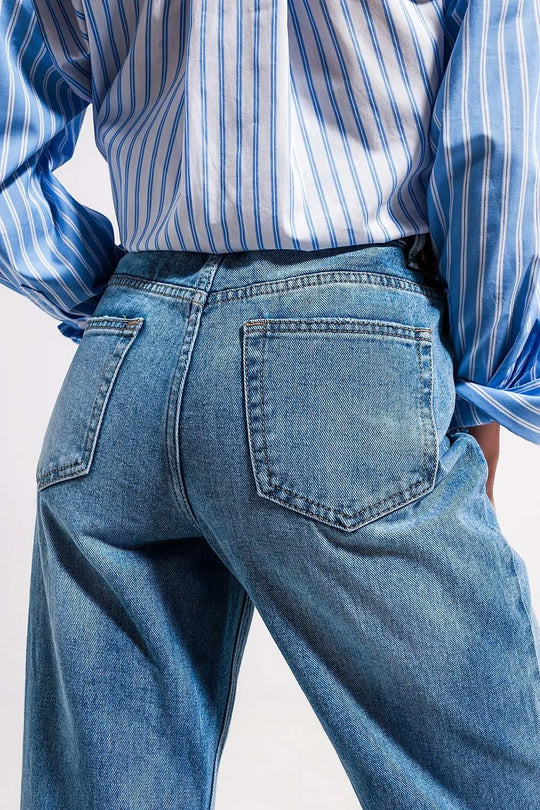 High waist jeans with split hem in vintage wash