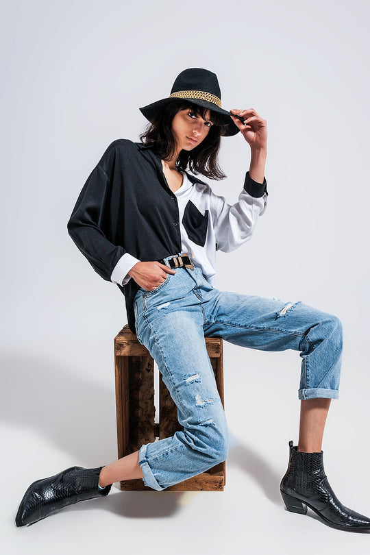 Distressed straight leg jean in medium denim