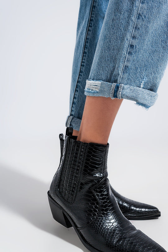 Distressed straight leg jean in medium denim