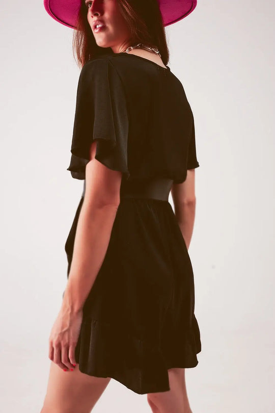 Wrap front frill hem jumpsuit in black - Jumpsuits