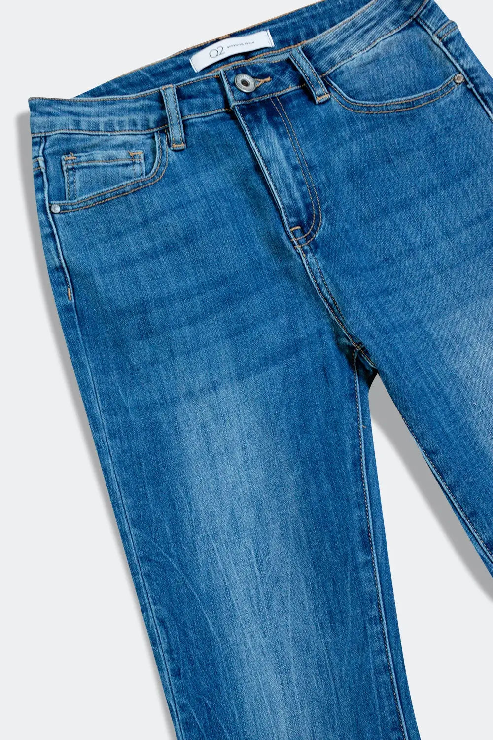 Flared jeans with raw edge in mid wash