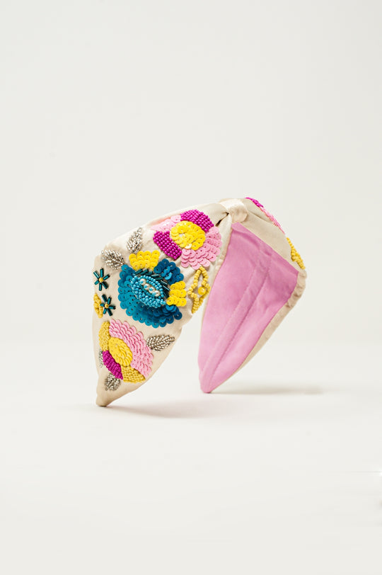 Knotted headband with embellished flowers in cream