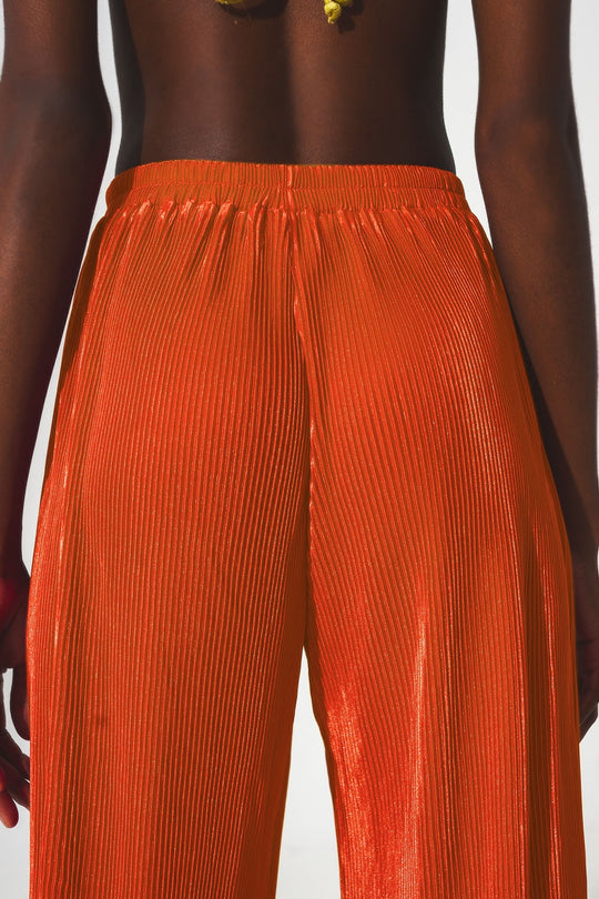 Satin pleated wide leg pants in orange