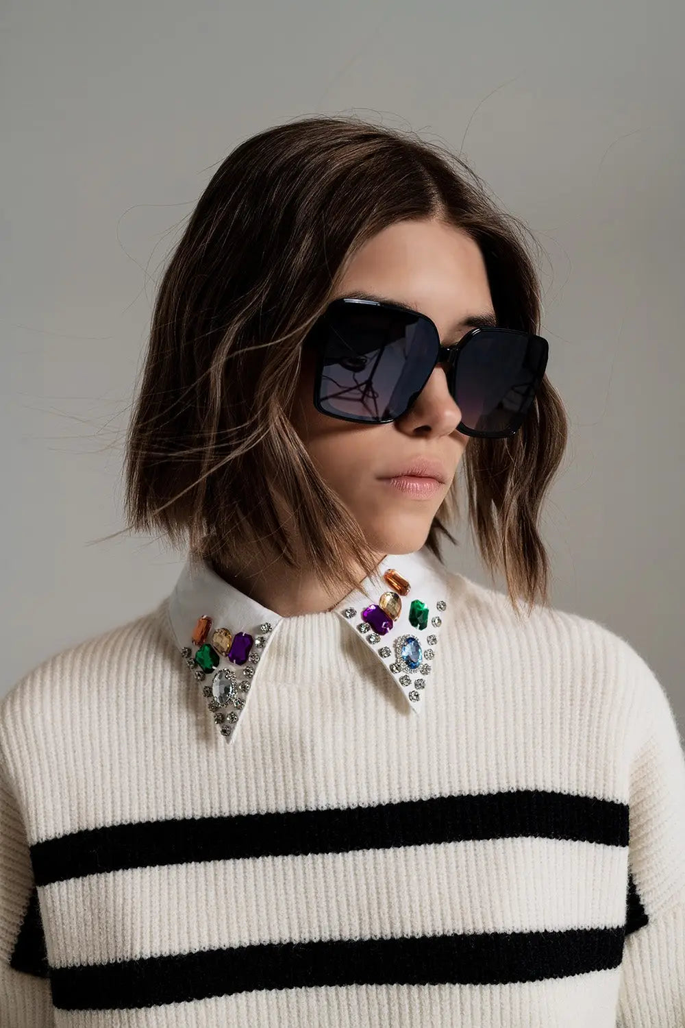 black striped jumper with blue stripe detail on the bottom - Sweaters