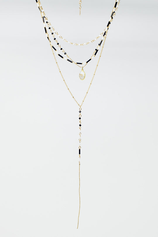 Gold 4 in 1 necklace with black and white beads