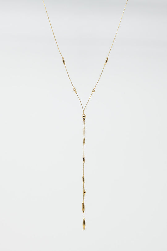 Long Gold Necklance with golden beads throughout and Long golden Tassle