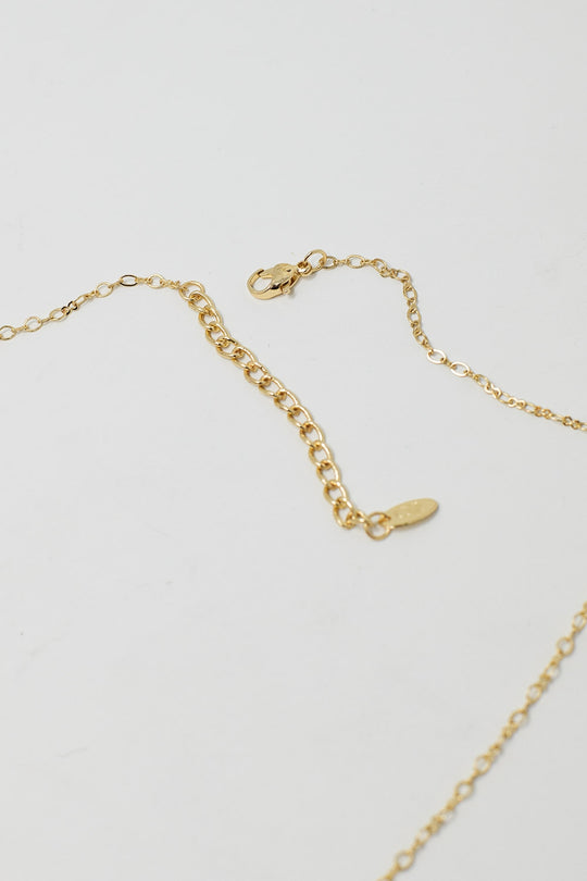 Golden Necklace with Star Charm and Green Bead