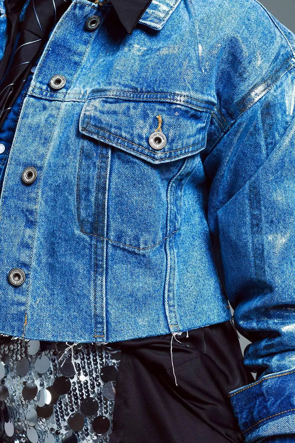 Cropped denim jacket with raw hem in mid wash with metallic silver finish - Jackets