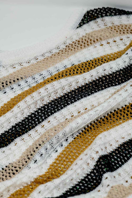 White knit sweater with multicolored stripes