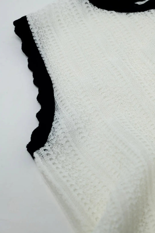 white knitted pointelle top with black wavy trim - Sweaters
