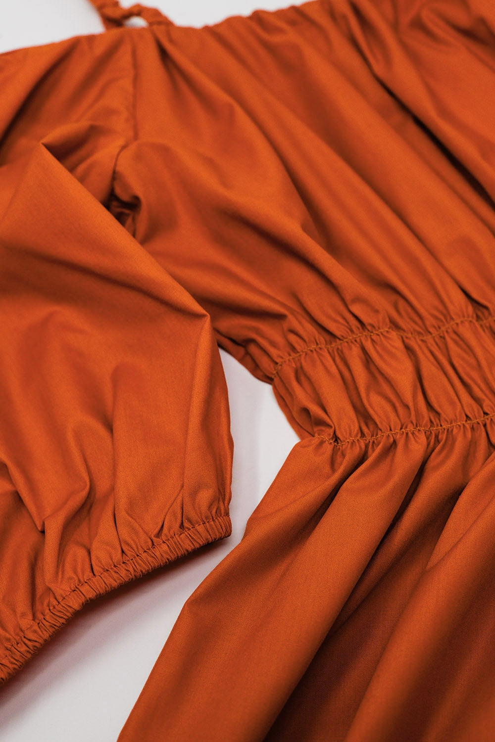 Midi orange dress with short sleeves and straps