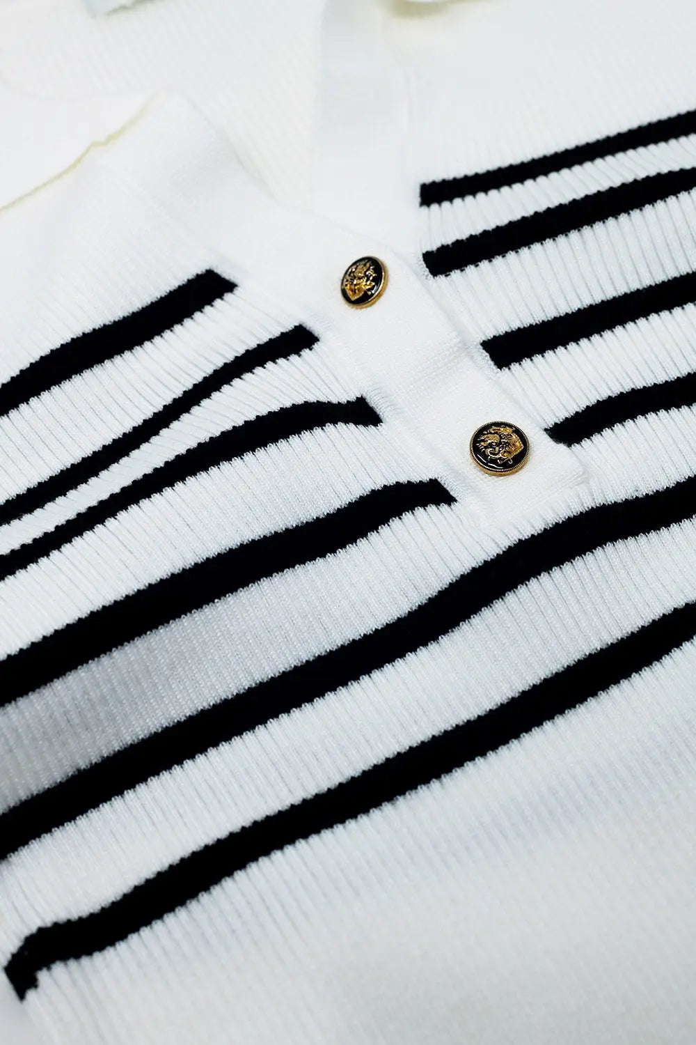 Striped polo with button detail in white - Sweaters