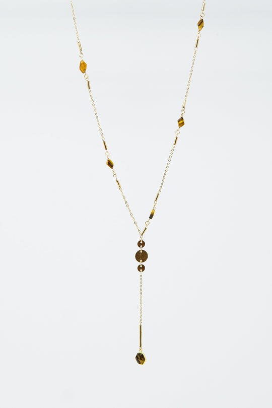 Golden necklace with stone detail and pendant
