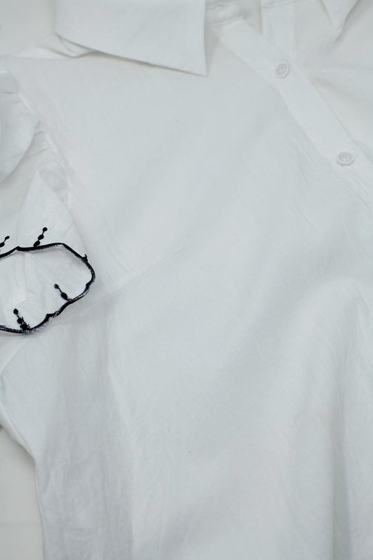 White Button Up Shirt With Polo Collar And Ruffled Sleeves With Black Trim